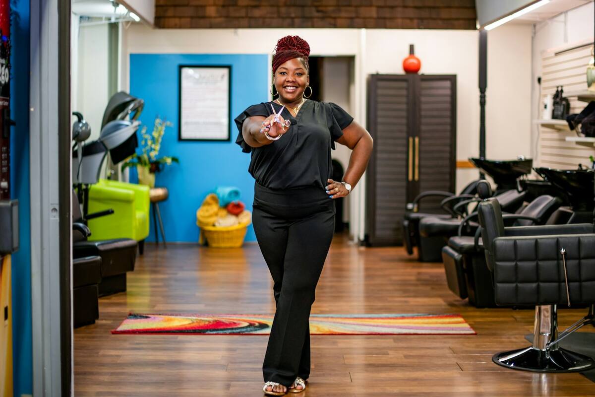 A salon owner standing in her salon