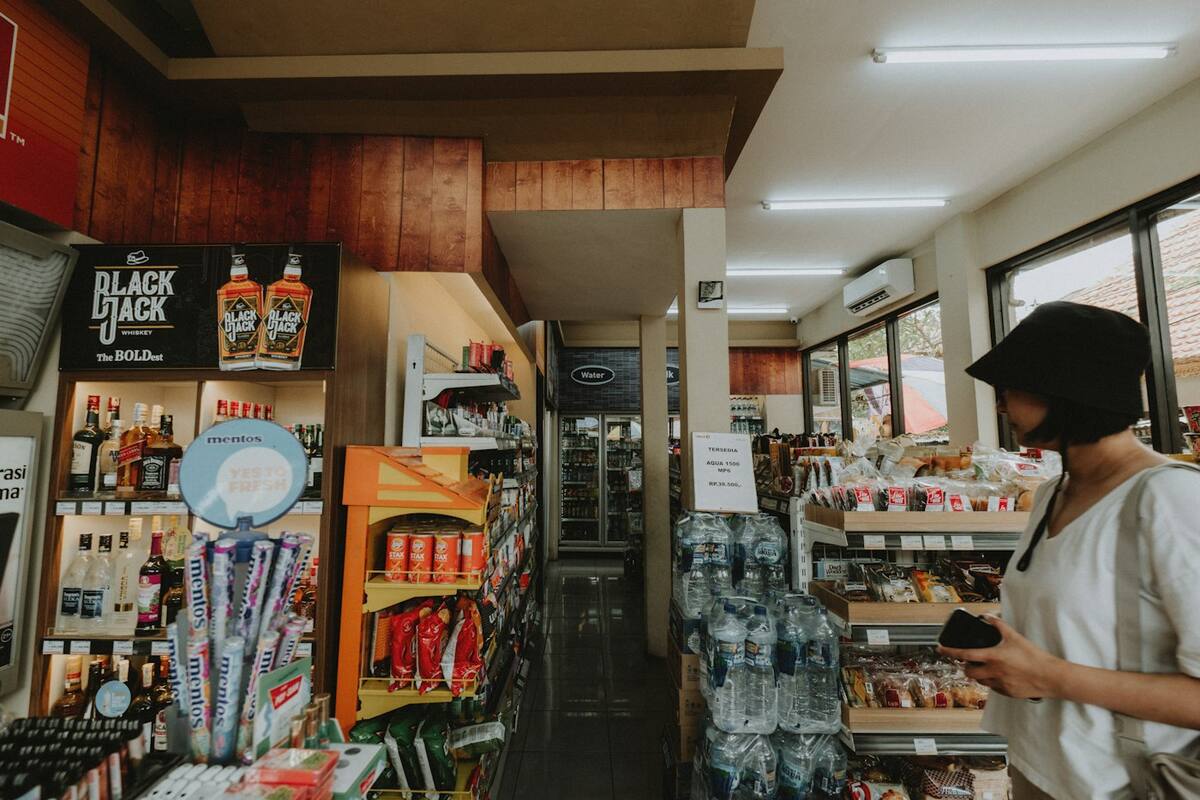 A woman browsing the shelves of a shop